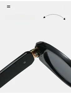 Macro detail of high-quality golden metal hinges on sleek black sunglasses frames