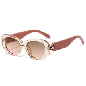 Oval cat-eye sunglasses with champagne resin frame and gradient lenses in 45-degree view