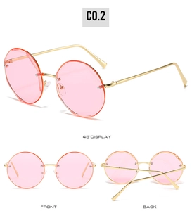 Three-angle view of pink rimless round sunglasses with slim gold metal frames and temples