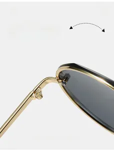 Macro view of durable metal hinge on stylish frameless sunglasses for women
