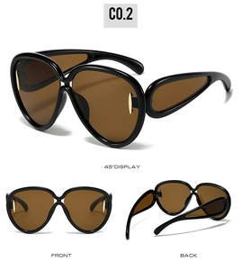 Detailed views of oversized black sunglasses with brown lenses and gold metal accents