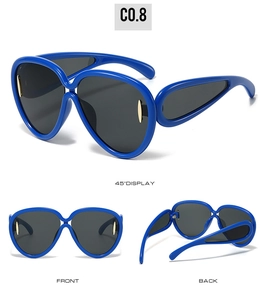 Detailed views of royal blue oversized sunglasses with hollow temples and gold accents