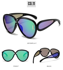 Macro detail of oversized sunglasses with gradient lenses and unique side teardrop panels