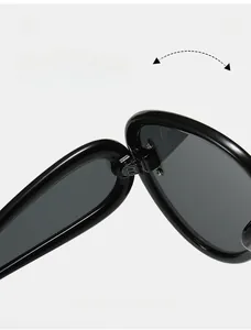 Close-up of durable metal hinges on oversized black frame sunglasses for smooth folding