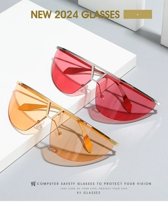 Detail of red and orange oversized shield sunglasses with rimless cut-edge design