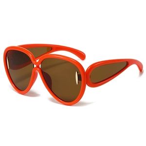 Chic oversized orange sunglasses with streamlined frames and gold metal accents