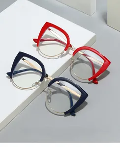 Detail of cat eye half-rim blue light blocking glasses with gold metal frames