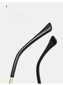Detail of curved ergonomic temple tips on black cat-eye glasses for comfortable wearing