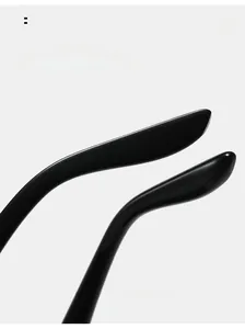 Close-up of sleek black curved mirror legs on fashion aviator sunglasses