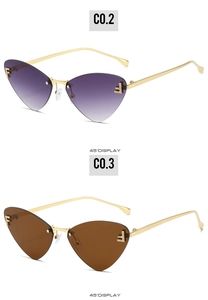 Detail view of rimless cat-eye sunglasses with rhinestone F logo and gradient lenses