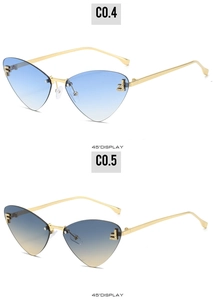 Detail of rimless cat-eye sunglasses featuring gradient lenses and rhinestone F letter