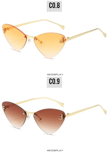 Detail view of rimless cat-eye sunglasses with gradient lenses and crystal F decoration