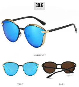 Three-view display of cat-eye sunglasses featuring blue mirrored lenses and gold metal trim