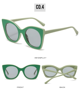 Vue triple des lunettes de soleil œil de chat vert herbe avec verres gris et monture épaisse