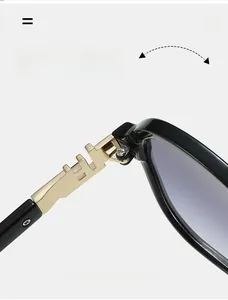 Macro detail of high-quality gold metal hinges on square black frame sunglasses