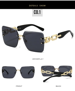 Detail view of rimless square sunglasses with gold chain-link metal temples and dark lenses