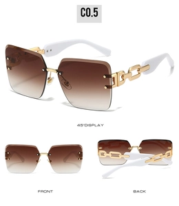Detail view of rimless sunglasses with gold chain accents and white temples