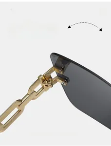 Close-up of durable gold metal chain hinge on rimless sunglasses for outdoor wear