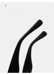 Detail of curved black mirror legs on rimless sunglasses for comfortable outdoor wear