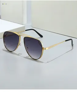 Detail of pilot sunglasses showing golden textured metal frame and purple gradient lenses