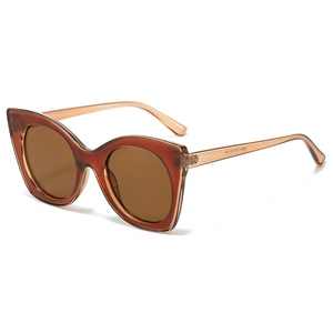 Lunettes de soleil œil-de-chat surdimensionnées avec monture ambre et verres teintés