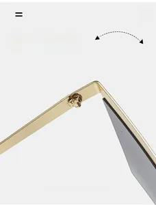 Close-up of durable metal hinge on stylish square frame sunglasses with gold finish