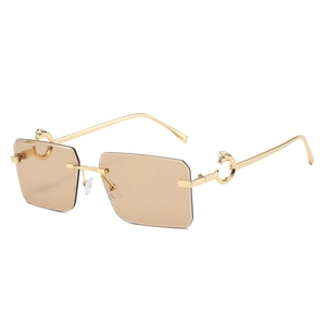 Luxury rimless rectangular sunglasses with gold leopard metal hinges and brown tinted lenses