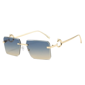 Rimless rectangle sunglasses with blue yellow gradient lenses and gold leopard hardware