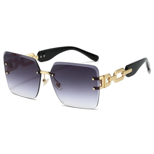 Frameless oversized sunglasses with purple gradient lenses and gold chain link temples