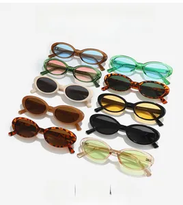 Stack of vintage oval sunglasses in multiple frame colors with metallic hinge detail