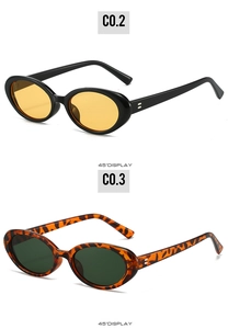 Detail view of retro oval sunglasses in black and tortoise frames at 45 degree angle