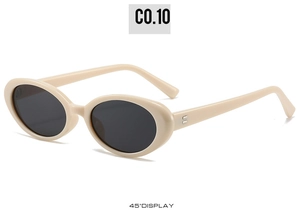 45-degree angle detail of retro oval beige sunglasses with metallic rivet accents