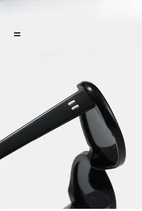 Detail view of glossy black sunglasses frame with metallic stripe accents and lightweight hinge