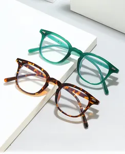 Detail view of retro square blue light blocking glasses in green and tortoiseshell frames