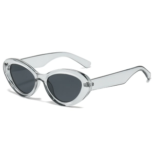 Retro cat-eye sunglasses with transparent grey frames and dark smoke lenses on white background