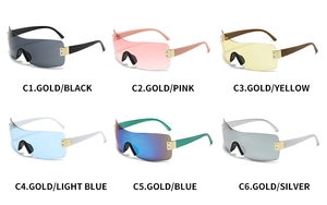 Selection of oversized rimless Y2K sunglasses in six vibrant colors with gold metal hinges