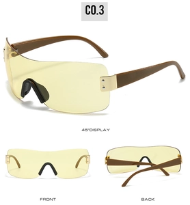 Three-view display of oversized yellow shield sunglasses with gold metal accents