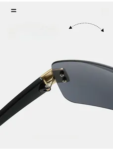 Close-up of durable golden metal hinge and screws on oversized black frame sunglasses