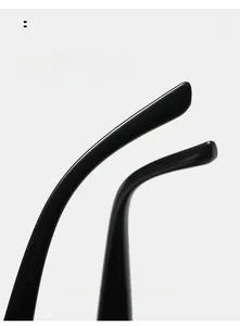 Macro detail of ergonomic curved mirror legs on oversized black punk sunglasses