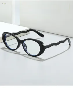 Detail of glossy black oval glasses featuring unique wave-shaped S-shaped temple design