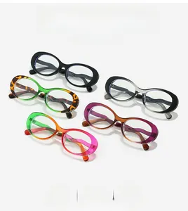 Detailed top view of various colored oval eyeglass frames on a white background