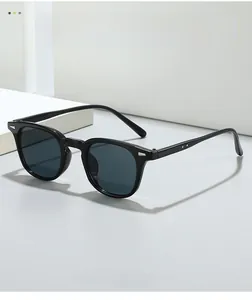 Detailed close-up of classic black D-frame sunglasses with elegant silver rivet details