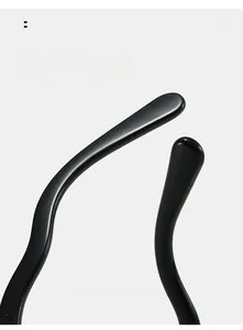 Macro detail of curved black eyeglass temples with smooth ergonomic high-gloss finish
