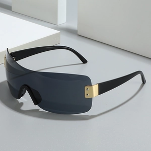 Oversized retro wrap-around sunglasses with dark lenses and gold metal hinge accents