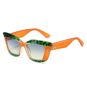 Chic cat-eye sunglasses with orange frames, leopard accents and blue-yellow gradient lenses