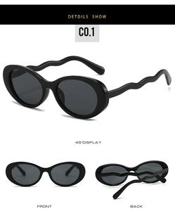 Detail view of oval retro sunglasses featuring unique wavy temples and a sleek black frame