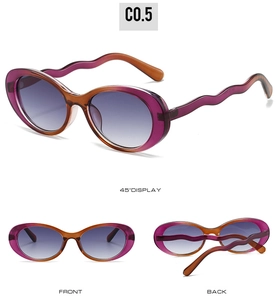Detail view of oval sunglasses featuring unique wavy temples and purple-orange gradient frame