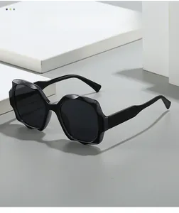 Macro detail of black square sunglasses with bold wavy geometric textured frames