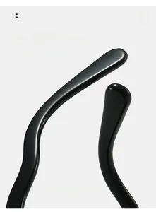 Macro view of curved mirror legs with ergonomic S-shape design on retro oval sunglasses