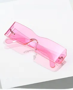 Detail view of pink rimless square sunglasses with scalloped lens edges and metal nose bridge